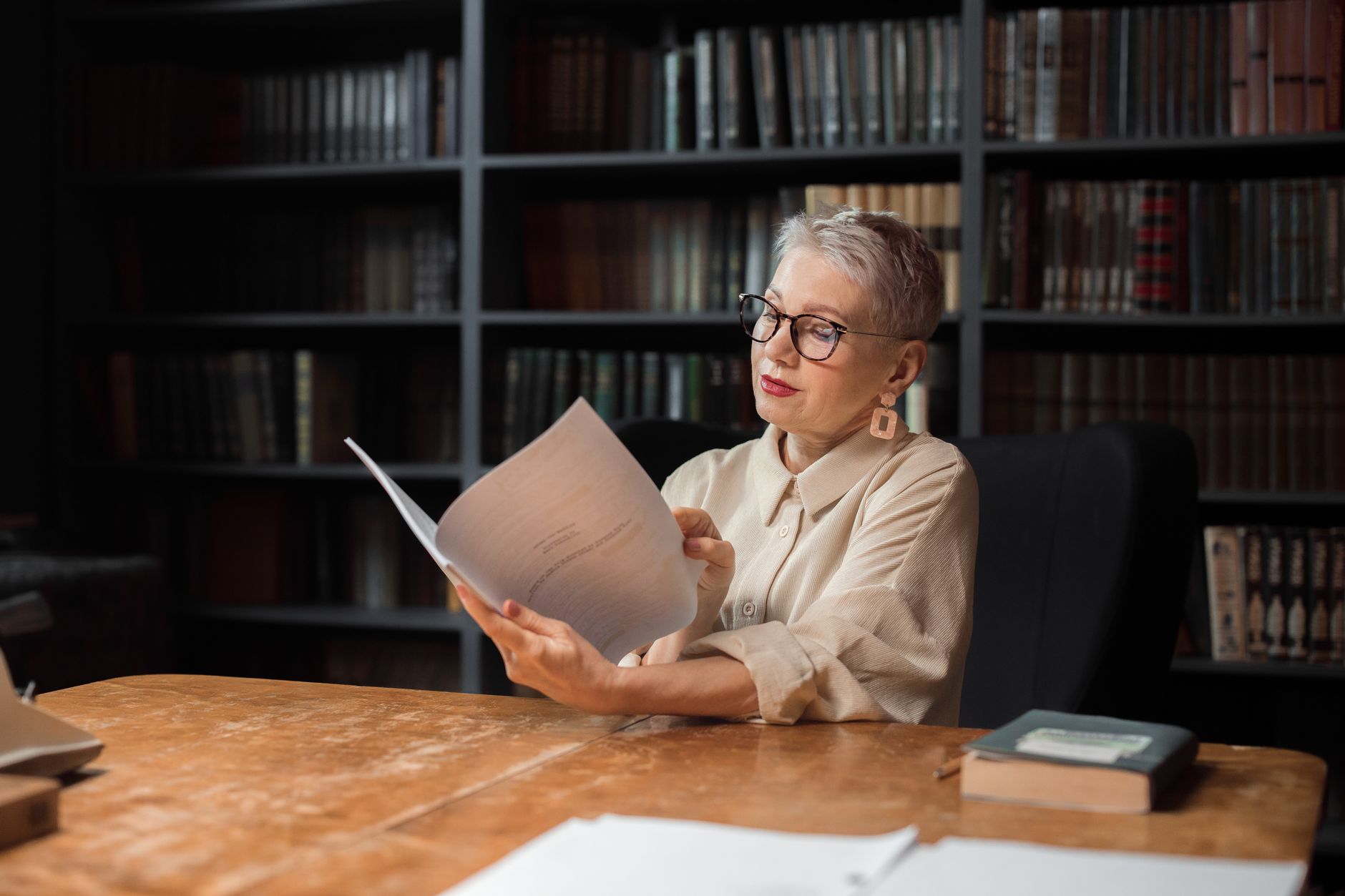 Travel writer with journal in secluded library